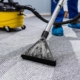 Worker cleaning commercial office carpet