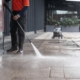 Worker pressure washing