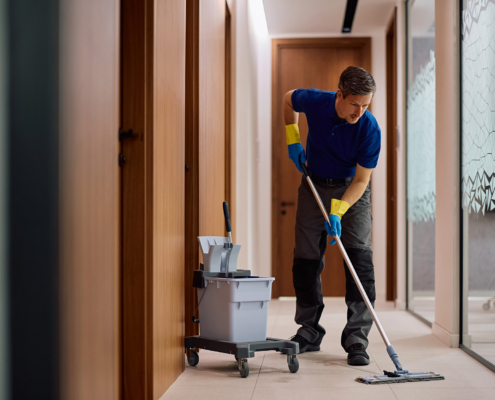 Worker Cleanings Floors Of Ofice
