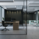 Modern Corporate Office Interior With Glass Partitions, Open Workspace And Lounge Area